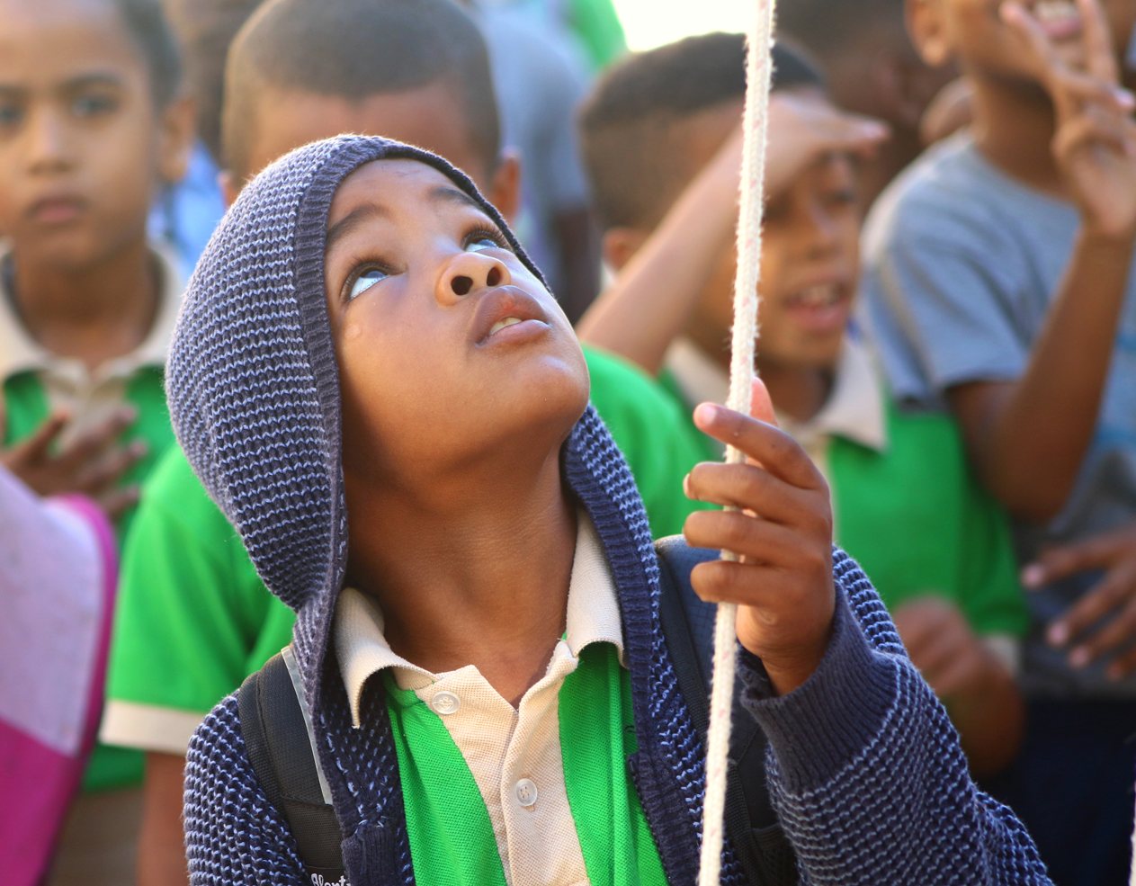 Student looking up during the flag raising